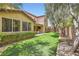 The expansive backyard has manicured landscaping and a seating area at 9192 Moose Country Pl, Las Vegas, NV 89178