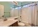 Bright bathroom featuring a shower over bath and a single sink at 9192 Moose Country Pl, Las Vegas, NV 89178