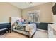 Comfortable bedroom with a large window, plush bedding, and carpet flooring at 9192 Moose Country Pl, Las Vegas, NV 89178