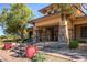 Elegant clubhouse features a stone facade, inviting entrance, and well-manicured landscaping at 9192 Moose Country Pl, Las Vegas, NV 89178