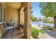 Inviting front porch with brick pavers and seating area at 9192 Moose Country Pl, Las Vegas, NV 89178