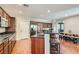 Spacious kitchen boasts granite countertops, stainless appliances, and a breakfast bar with seating at 9192 Moose Country Pl, Las Vegas, NV 89178