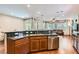 Open kitchen with breakfast bar, granite countertops, and stainless steel appliances at 9192 Moose Country Pl, Las Vegas, NV 89178