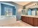 Spacious main bathroom with a soaking tub, a large vanity, and tile flooring at 9192 Moose Country Pl, Las Vegas, NV 89178