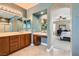 Large main bathroom with dual sinks, lots of counter space, and an entrance to the main bedroom at 9192 Moose Country Pl, Las Vegas, NV 89178