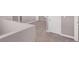 Upstairs hallway with neutral carpet and white trim at 9330 Brookmont Ave, Las Vegas, NV 89149