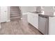 Kitchen island with stainless steel dishwasher, cabinets, and granite countertops at 9330 Brookmont Ave, Las Vegas, NV 89149