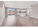 Spacious living room with an open layout, flowing into a kitchen, perfect for entertaining and modern living at 9330 Brookmont Ave, Las Vegas, NV 89149