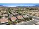 This home features desert landscaping and beautiful views of the surrounding neighborhood and mountains at 1008 New Creek Ave, Henderson, NV 89015