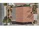 Aerial view showcasing the home's tile roof, covered patio, and landscaped backyard at 1008 New Creek Ave, Henderson, NV 89015