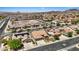 Aerial shot of homes in a suburban neighborhood, highlighting the tile roofs and streetscape at 1008 New Creek Ave, Henderson, NV 89015