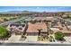 Overhead view of a neighborhood with a desert landscape, tile roofs, and mountain views in the background at 1008 New Creek Ave, Henderson, NV 89015