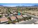 This home features desert landscaping and beautiful views of the surrounding neighborhood and mountains at 1008 New Creek Ave, Henderson, NV 89015