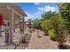 Landscaped backyard with covered patio and gravel landscaping, offering low-maintenance beauty at 1008 New Creek Ave, Henderson, NV 89015