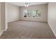 Spacious bedroom featuring neutral walls, plush carpeting, and plenty of natural light at 1008 New Creek Ave, Henderson, NV 89015