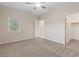 This bedroom includes an open closet and a window with great lighting at 1008 New Creek Ave, Henderson, NV 89015