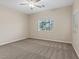Cozy bedroom featuring a ceiling fan and a window at 1008 New Creek Ave, Henderson, NV 89015