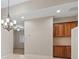 This Dining room features updated floors, built in cabinets and a chandelier at 1008 New Creek Ave, Henderson, NV 89015
