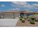 Well-maintained home with xeriscape landscaping, three-car garage, and stone accents on the posts at 1008 New Creek Ave, Henderson, NV 89015