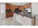 Kitchen with stainless appliances, granite countertops and wood cabinets at 1008 New Creek Ave, Henderson, NV 89015