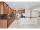 Open kitchen with stainless steel appliances and granite countertops at 1008 New Creek Ave, Henderson, NV 89015
