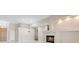 Bright living room with fireplace and elegant chandelier at 1008 New Creek Ave, Henderson, NV 89015
