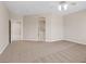 Large carpeted bedroom with ensuite bath access, neutral colors, ceiling fan at 1008 New Creek Ave, Henderson, NV 89015