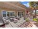 Charming covered patio with ample seating, perfect for enjoying outdoor meals and gatherings at 1008 New Creek Ave, Henderson, NV 89015