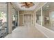 Bright sunroom boasts neutral walls, tile flooring, and backyard access at 1008 New Creek Ave, Henderson, NV 89015