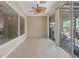 Sunroom featuring neutral walls, tile flooring, and access to the backyard at 1008 New Creek Ave, Henderson, NV 89015