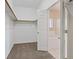Walk-in closet with ample shelving and hanging space, adjacent to the bathroom at 1008 New Creek Ave, Henderson, NV 89015