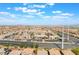 Panoramic aerial view of a planned community with shops and restaurants along a wide boulevard at 10315 Turia Gardens Rd, Las Vegas, NV 89135