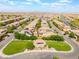 Aerial view featuring a home with solar panels and a lush community, highlighting suburban living and amenities at 10315 Turia Gardens Rd, Las Vegas, NV 89135