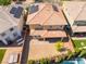 Backyard aerial view of desert landscaping with a covered patio and privacy, with neighbor's pool in the distance at 10315 Turia Gardens Rd, Las Vegas, NV 89135