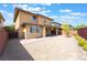 Spacious backyard with a covered patio, perfect for outdoor gatherings and enjoying the beautiful weather at 10315 Turia Gardens Rd, Las Vegas, NV 89135