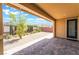 Inviting backyard with covered patio, brick flooring, and well-maintained landscaping for relaxed outdoor living at 10315 Turia Gardens Rd, Las Vegas, NV 89135