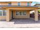 Charming covered patio with brick pavers, offering a serene space for relaxation and outdoor enjoyment at 10315 Turia Gardens Rd, Las Vegas, NV 89135