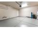Spacious garage with epoxy flooring, overhead door opener, and ample room for storage at 10315 Turia Gardens Rd, Las Vegas, NV 89135