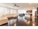 Open-concept living space with hardwood floors, modern lighting and neutral decor at 10315 Turia Gardens Rd, Las Vegas, NV 89135