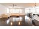 Expansive open-concept living area with polished wood floors and ample natural light at 10315 Turia Gardens Rd, Las Vegas, NV 89135