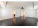 Spacious main bedroom featuring hardwood floors, modern ceiling fan and a tray ceiling at 10315 Turia Gardens Rd, Las Vegas, NV 89135