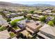 Neighborhood aerial view featuring homes with solar panels, highlighting energy efficiency and community living at 10315 Turia Gardens Rd, Las Vegas, NV 89135
