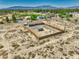 Aerial view of a Nevada property, fully fenced with desert landscaping at 1190 W Sierra Vista Cir, Pahrump, NV 89060