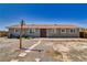 Rear view of home, featuring a patio and spacious backyard at 1190 W Sierra Vista Cir, Pahrump, NV 89060