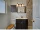 Bathroom featuring a vanity, decorative lighting, and a walk-in shower at 1190 W Sierra Vista Cir, Pahrump, NV 89060