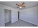 Bedroom featuring gray wood-look flooring, a ceiling fan and a closet at 1190 W Sierra Vista Cir, Pahrump, NV 89060