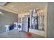 Garage featuring a stainless steel refrigerator, washer, dryer and water heater at 1190 W Sierra Vista Cir, Pahrump, NV 89060