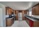 The kitchen has stainless steel appliances, granite countertops, and warm wood cabinetry at 1190 W Sierra Vista Cir, Pahrump, NV 89060