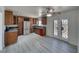 Open kitchen and dining area with stainless steel appliances, granite countertops, and wood cabinets at 1190 W Sierra Vista Cir, Pahrump, NV 89060
