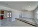 Bright living space with new floors, neutral walls, ceiling fans and connecting kitchen access at 1190 W Sierra Vista Cir, Pahrump, NV 89060